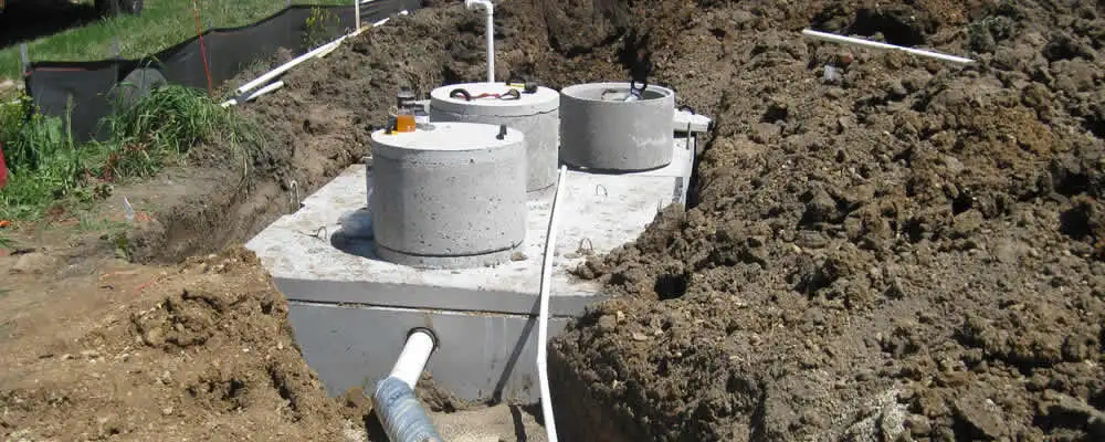 Septic system repair and installation site with tank access ports in Modesto, CA